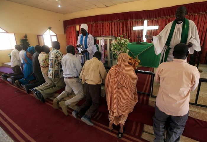 Worshippers in Baraka Parish church on the outskirts of Sudan's capital, Khartoum. Christians are being targeted in the Muslim-majority country.