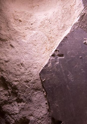 Inscribed with a Christian cross, this broken marble slab may date to the Crusader era. PHOTOGRAPH BY ODED BALILTY, AP FOR NATIONAL GEOGRAPHIC