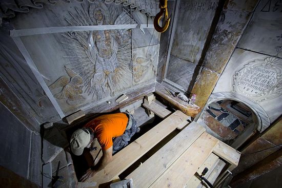 A conservator cleans the surface of the stone slab venerated as the final resting place of Jesus Christ. PHOTOGRAPH BY ODED BALILTY, AP FOR NATIONAL GEOGRAPHIC