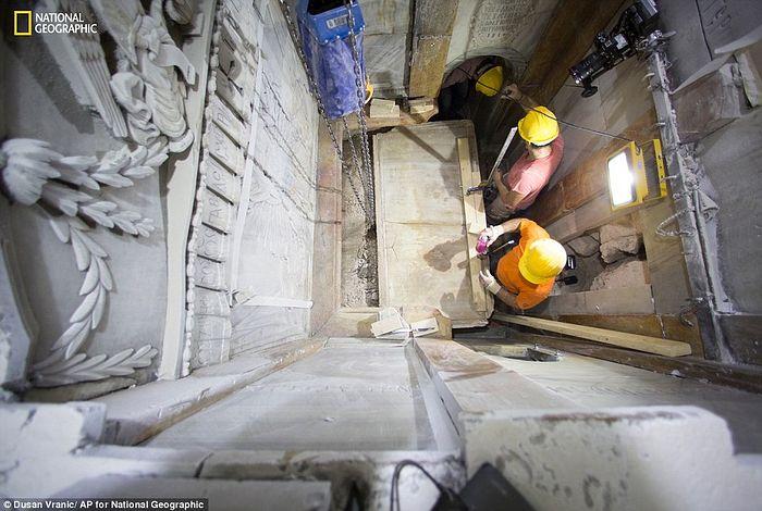 The burial slab (pictured being revealed from its marble case last month) many Christians believe once held the body of Jesus Christ has been uncovered by scientists for the first time in centuries. The original surface, partially shown in this picture, was exposed during restoration work at the Church of the Holy Sepulchre in the Old City of Jerusalem