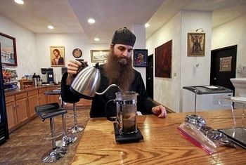 Daniel Armstrong, a monk at St. Tikhon's Monastery, prepares a French press as he makes coffee inside the bookstore at 175 St. Tikhons Road in Waymart. The monastery recently opened Burning Bush Coffee Roasting, where they prepare and package coffee beans from around the world. Michael J. Mullen / Staff Photographer