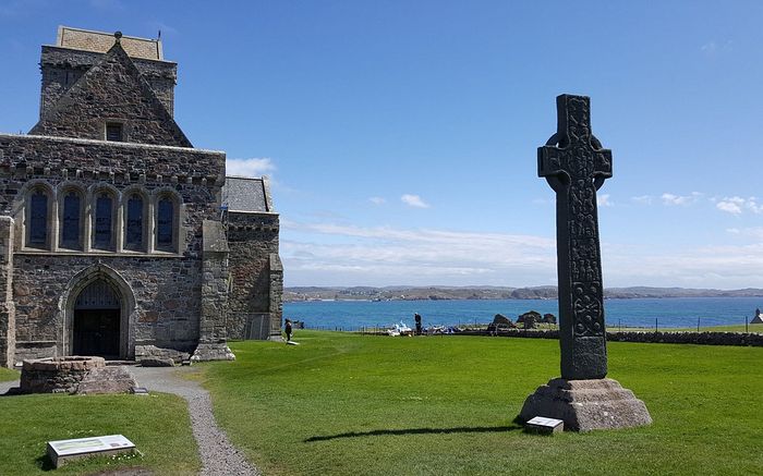 Iona Abbey and St. Martin's cross, as archaeologists have uncovered conclusive evidence that a wooden hut traditionally associated with St. Columba at his ancient monastery on the island of Iona dates to his lifetime in the late sixth century CREDIT: PA