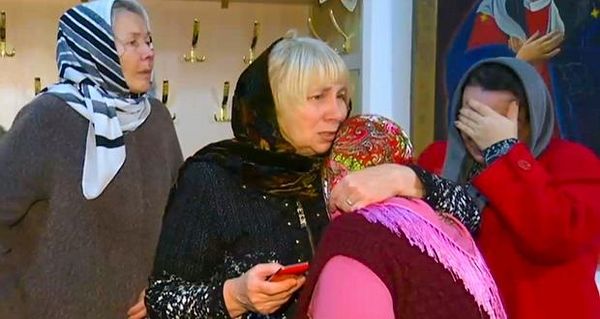 A group of women comfort each other after a memorial service in the Russian Orthodox Church in Kizlyar, Russia on Monday, following Sunday’s gun attack. Photograph: RU-RTR Russian Television via AP 