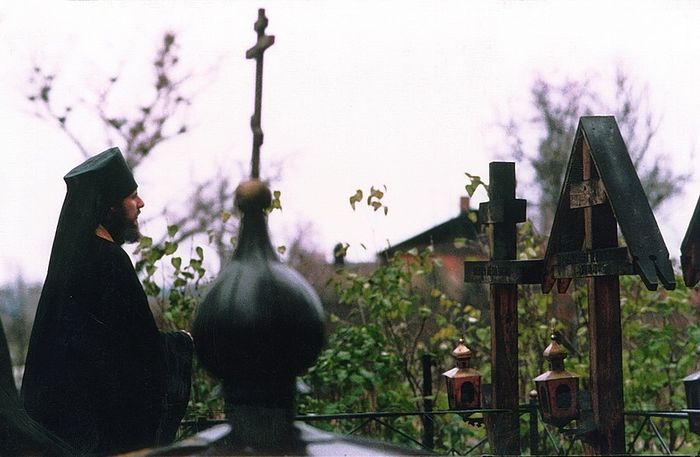Hieromonk Vasily before the graves of the Optina elders